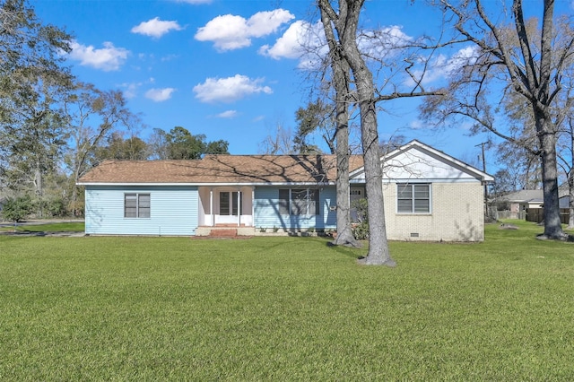 rear view of house with a yard