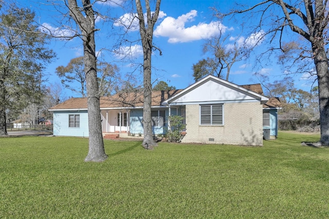 rear view of property with a yard