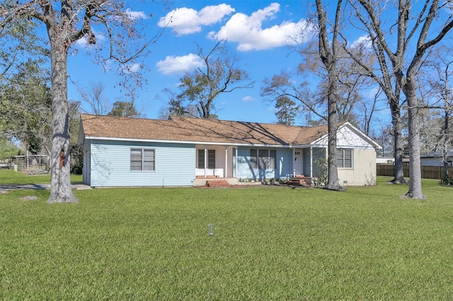 ranch-style home with a front lawn