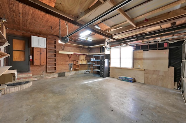 basement featuring wooden walls