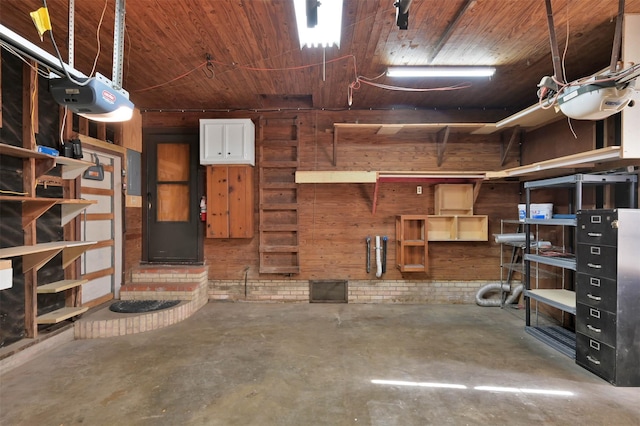 garage featuring wood ceiling, a garage door opener, and wooden walls