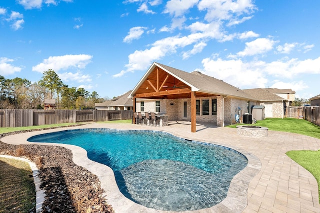 view of pool with cooling unit, an outdoor fire pit, and a patio