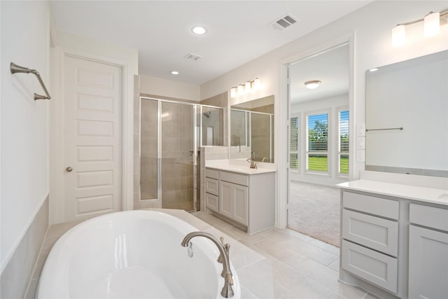 bathroom with vanity and plus walk in shower