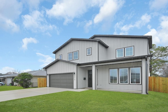 view of front facade with a garage and a front yard