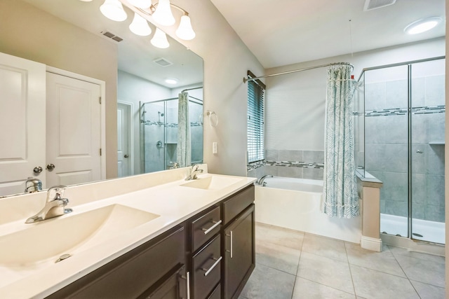 bathroom featuring vanity, independent shower and bath, and tile patterned flooring