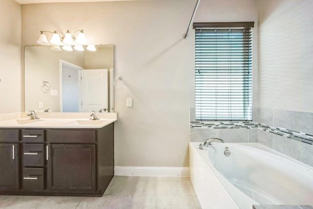 bathroom featuring tile patterned floors, vanity, and a washtub