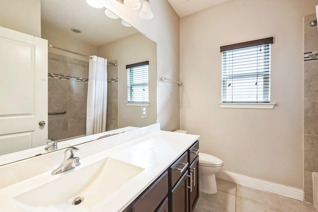 bathroom featuring walk in shower, vanity, toilet, and tile patterned flooring