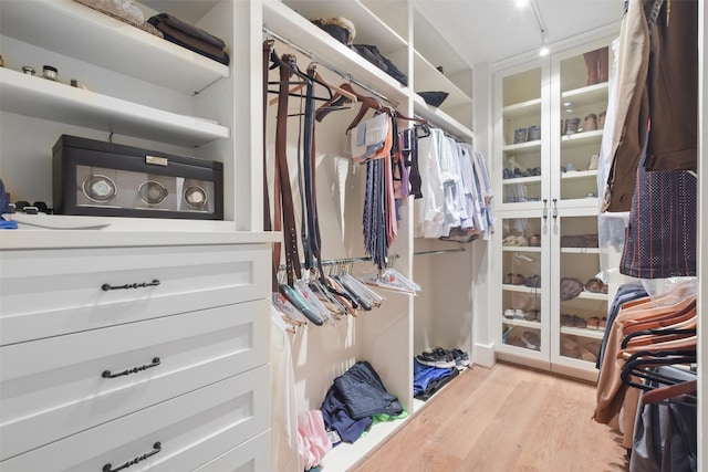 spacious closet featuring light hardwood / wood-style floors