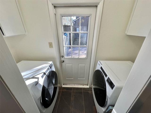 clothes washing area with washer and clothes dryer