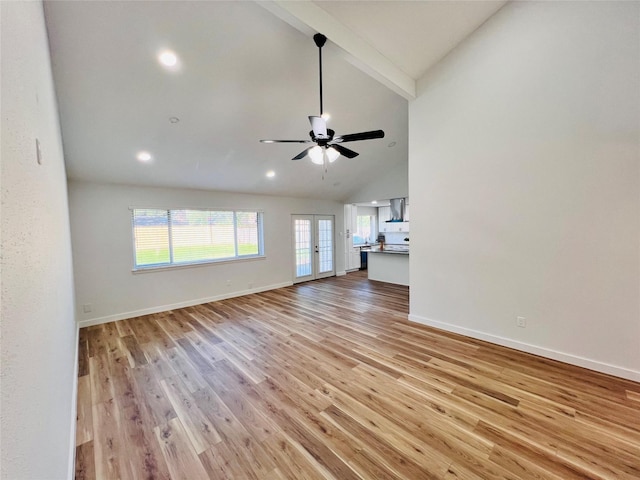 unfurnished living room featuring french doors, high vaulted ceiling, light wood-type flooring, beamed ceiling, and ceiling fan