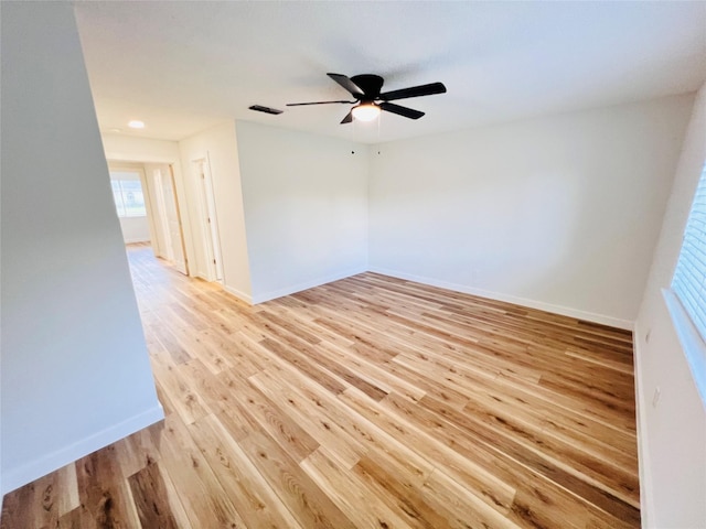 unfurnished room featuring ceiling fan and light hardwood / wood-style floors