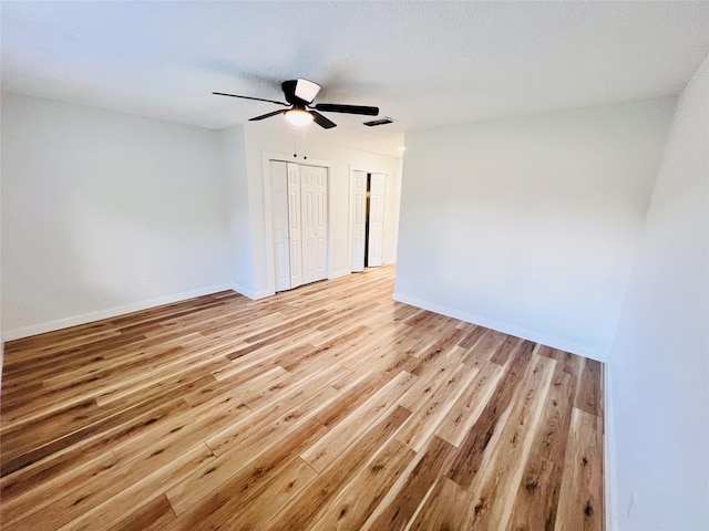 unfurnished room featuring light hardwood / wood-style floors and ceiling fan