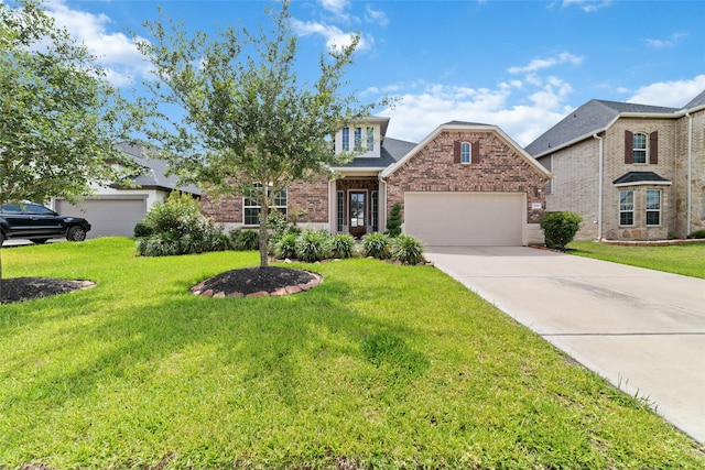 view of front of property with a garage and a front yard