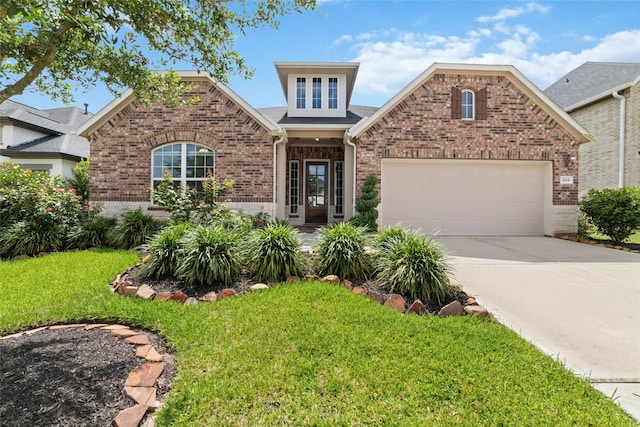 view of front facade with a garage and a front yard