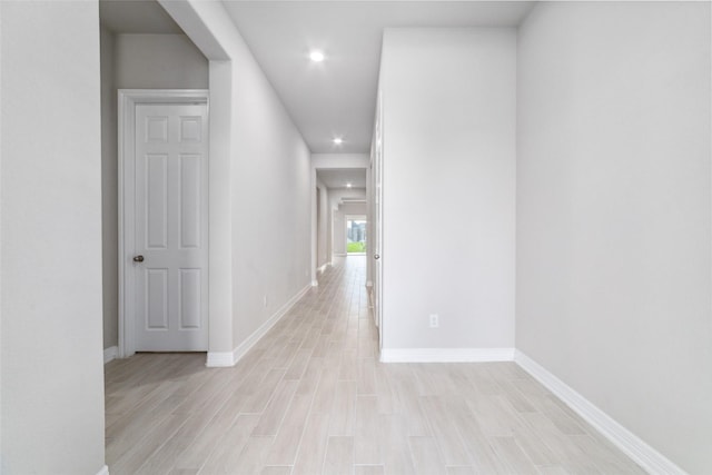 hall with light hardwood / wood-style floors