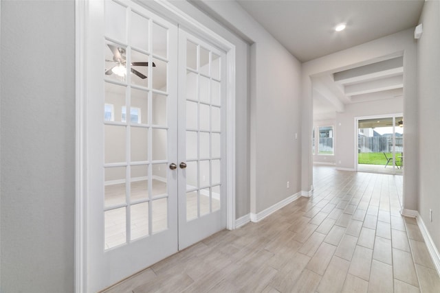 interior space featuring french doors and ceiling fan