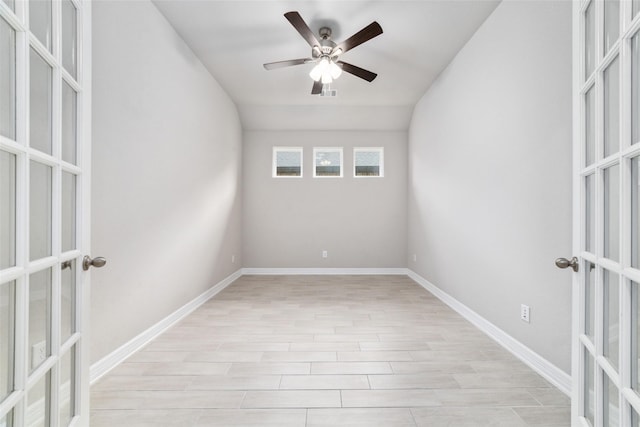 empty room featuring french doors, ceiling fan, and light hardwood / wood-style flooring