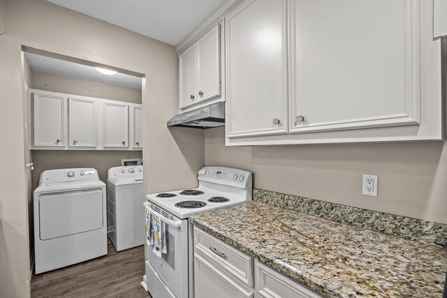 250 El Dorado Blvd Unit 127, Webster, TX 77598 - kitchen featuring white electric range oven, under cabinet range hood, washer and dryer, dark wood-style floors, and white cabinets