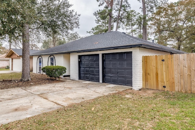 view of front of house with a garage and a front yard