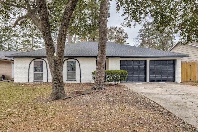 single story home featuring a garage