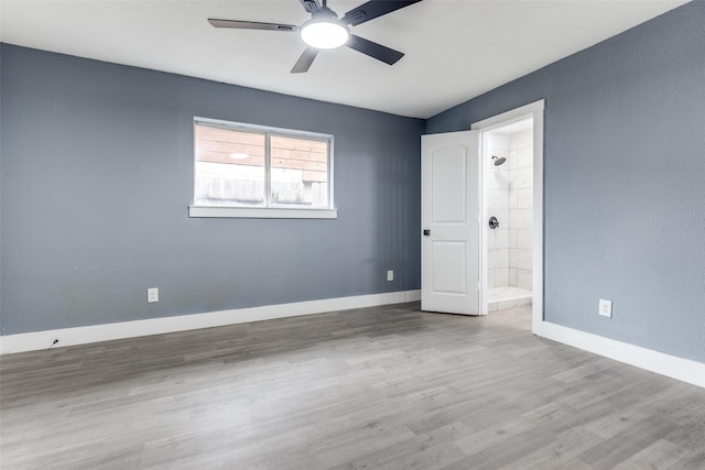 unfurnished room featuring ceiling fan and light wood-type flooring