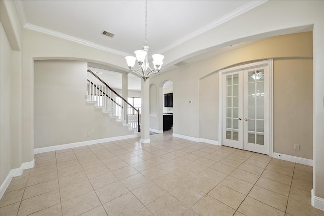 interior space featuring an inviting chandelier, crown molding, french doors, and light tile patterned flooring