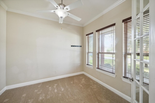 unfurnished room with ceiling fan, crown molding, carpet floors, and a healthy amount of sunlight