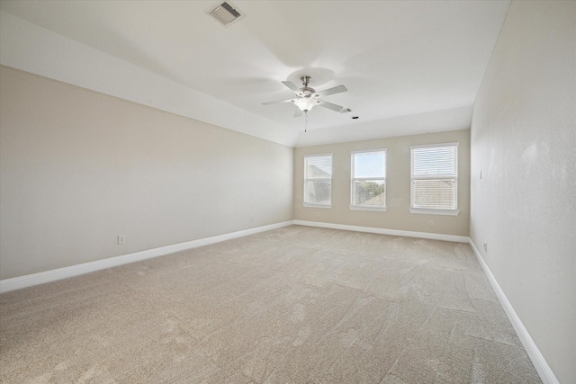 carpeted spare room featuring ceiling fan