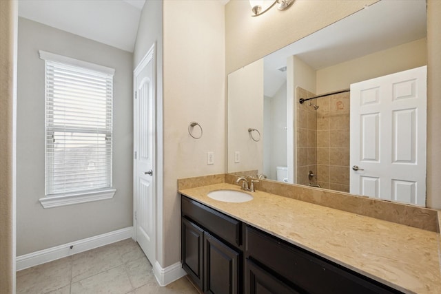 bathroom with vanity, toilet, and tile patterned flooring