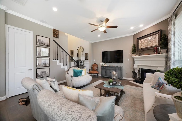 living room featuring crown molding, dark hardwood / wood-style floors, and ceiling fan