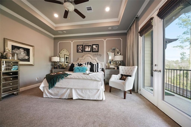 carpeted bedroom with a raised ceiling, access to outside, ceiling fan, and french doors