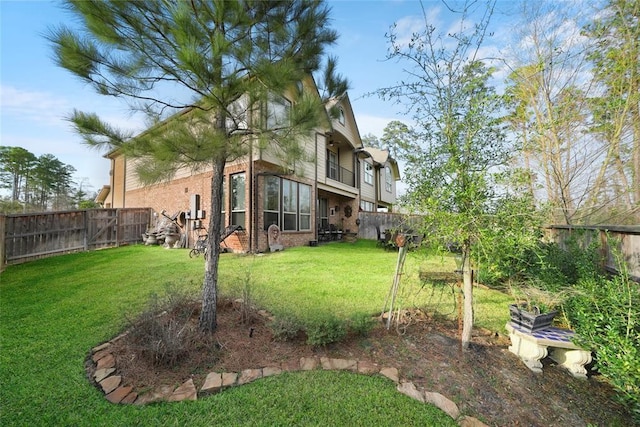 view of yard featuring a balcony