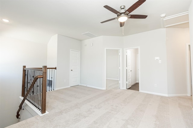 empty room with light carpet and ceiling fan