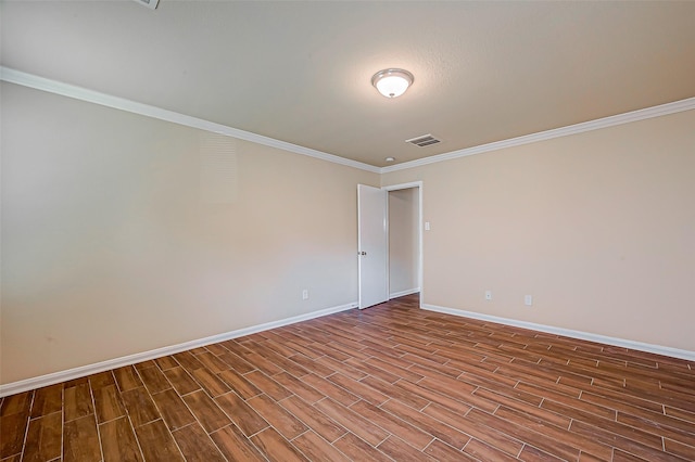 unfurnished room featuring crown molding