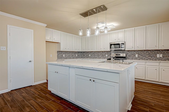 kitchen featuring pendant lighting, sink, light stone counters, white cabinets, and dark hardwood / wood-style flooring