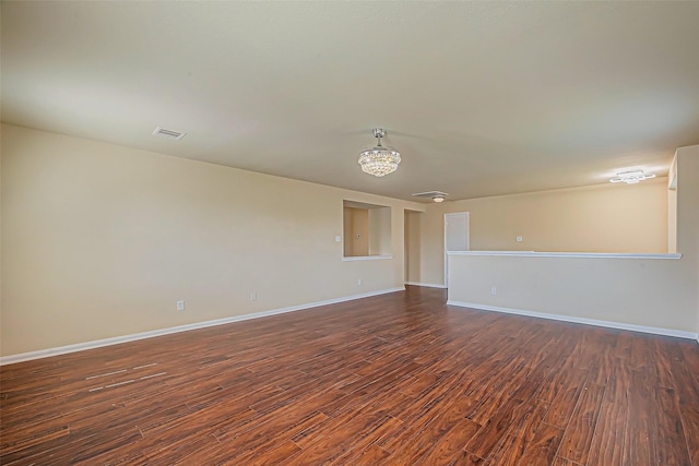 unfurnished room featuring dark hardwood / wood-style floors