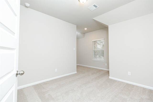 empty room with light colored carpet