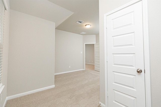 empty room with light colored carpet