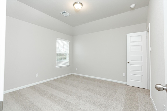 unfurnished room featuring light colored carpet