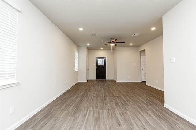 foyer featuring ceiling fan and wood-type flooring