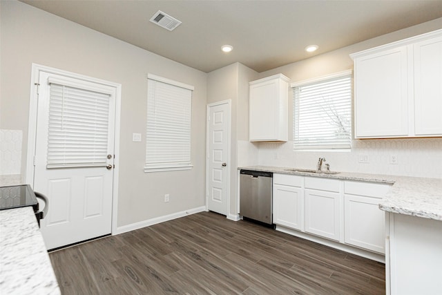 kitchen with white cabinetry, sink, dark hardwood / wood-style flooring, stainless steel dishwasher, and light stone counters