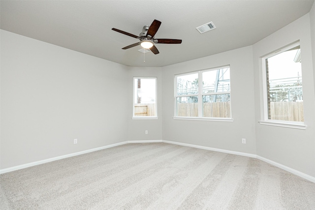 empty room with carpet floors and ceiling fan