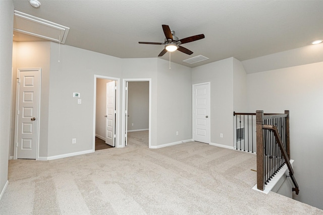 empty room featuring light colored carpet and ceiling fan