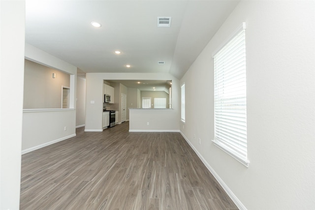 unfurnished living room with hardwood / wood-style flooring