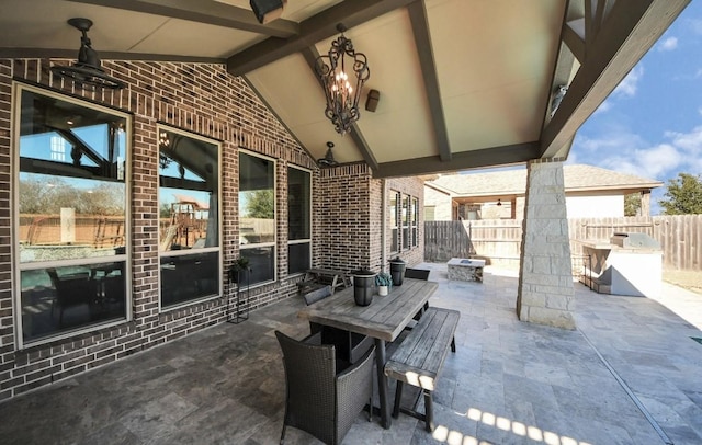 view of patio featuring a fire pit and ceiling fan