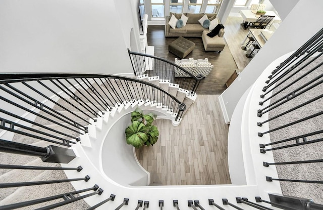 stairway featuring hardwood / wood-style flooring