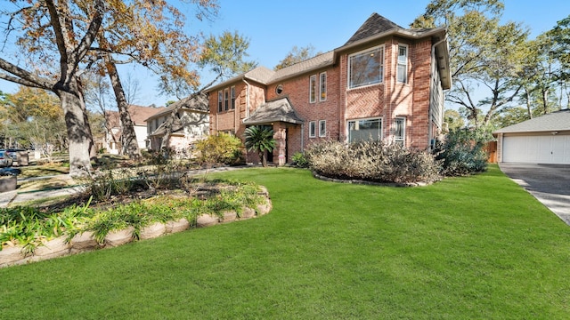 view of front of property featuring a garage and a front yard