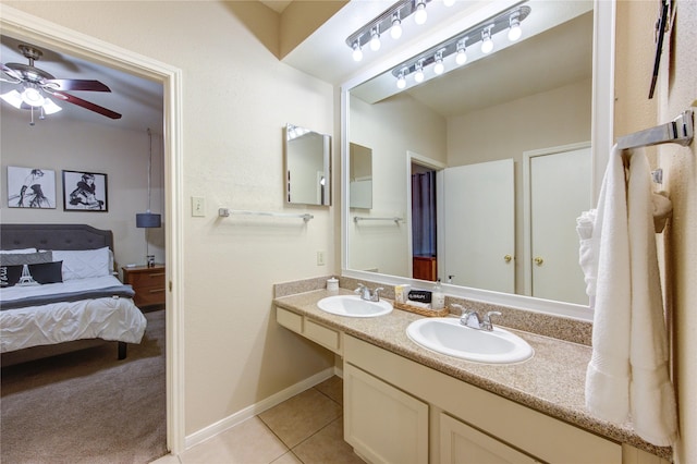 bathroom with ceiling fan, tile patterned floors, and vanity