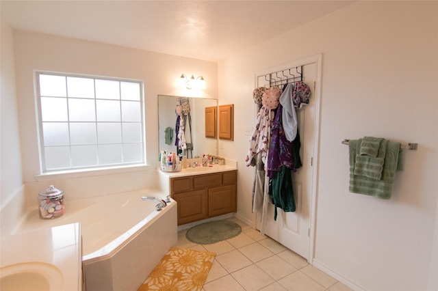 bathroom featuring tile patterned flooring, vanity, and a bathtub