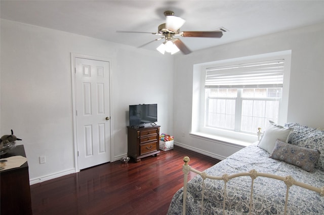 bedroom featuring dark hardwood / wood-style flooring and ceiling fan